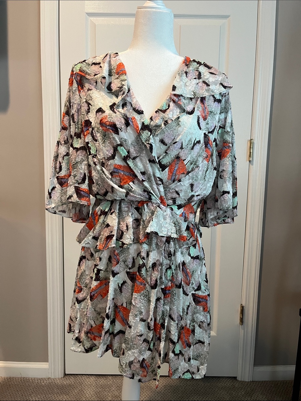 Printed Flutter Sleeve Wrap Dress in White with Orange Accents
